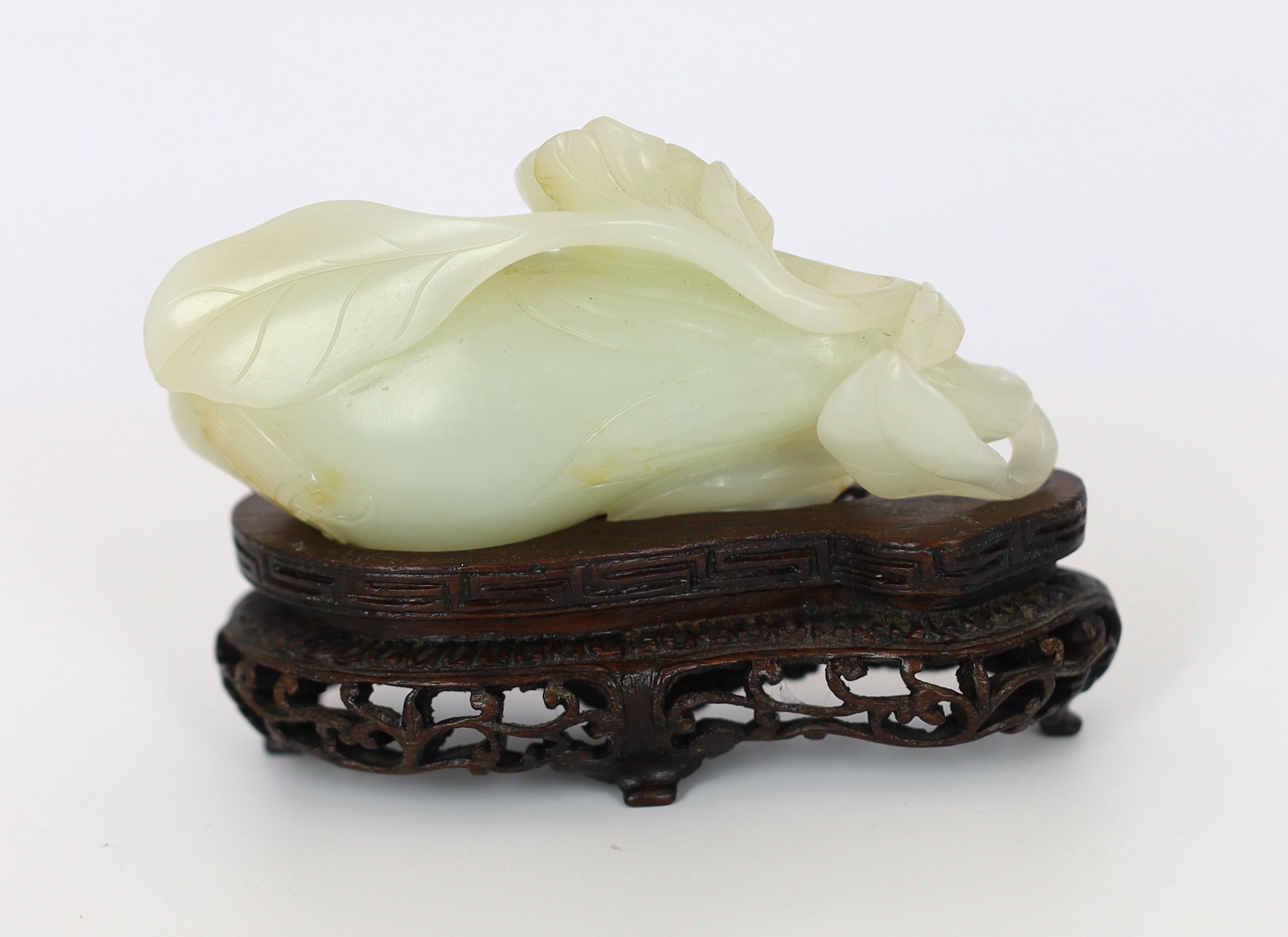 A Chinese pale celadon jade carving of a fruit, 18th century